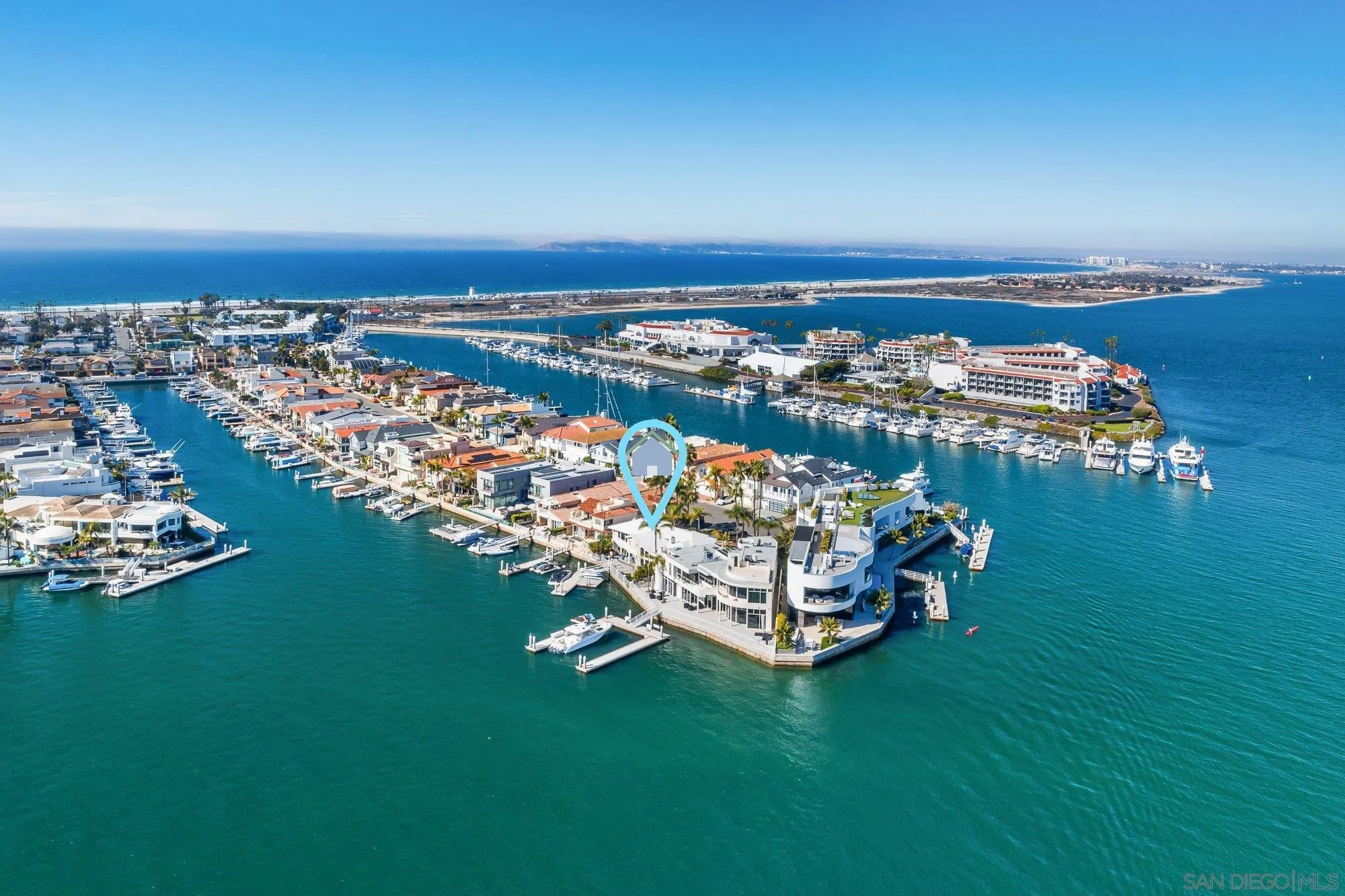 a view of a lake with lawn chairs