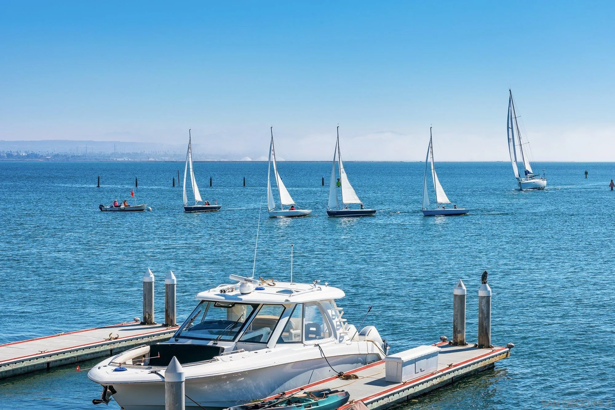 2 The Point Coronado, CA 92118 - Photo 25 of 54 a backyard of a house with table chairs and chairs