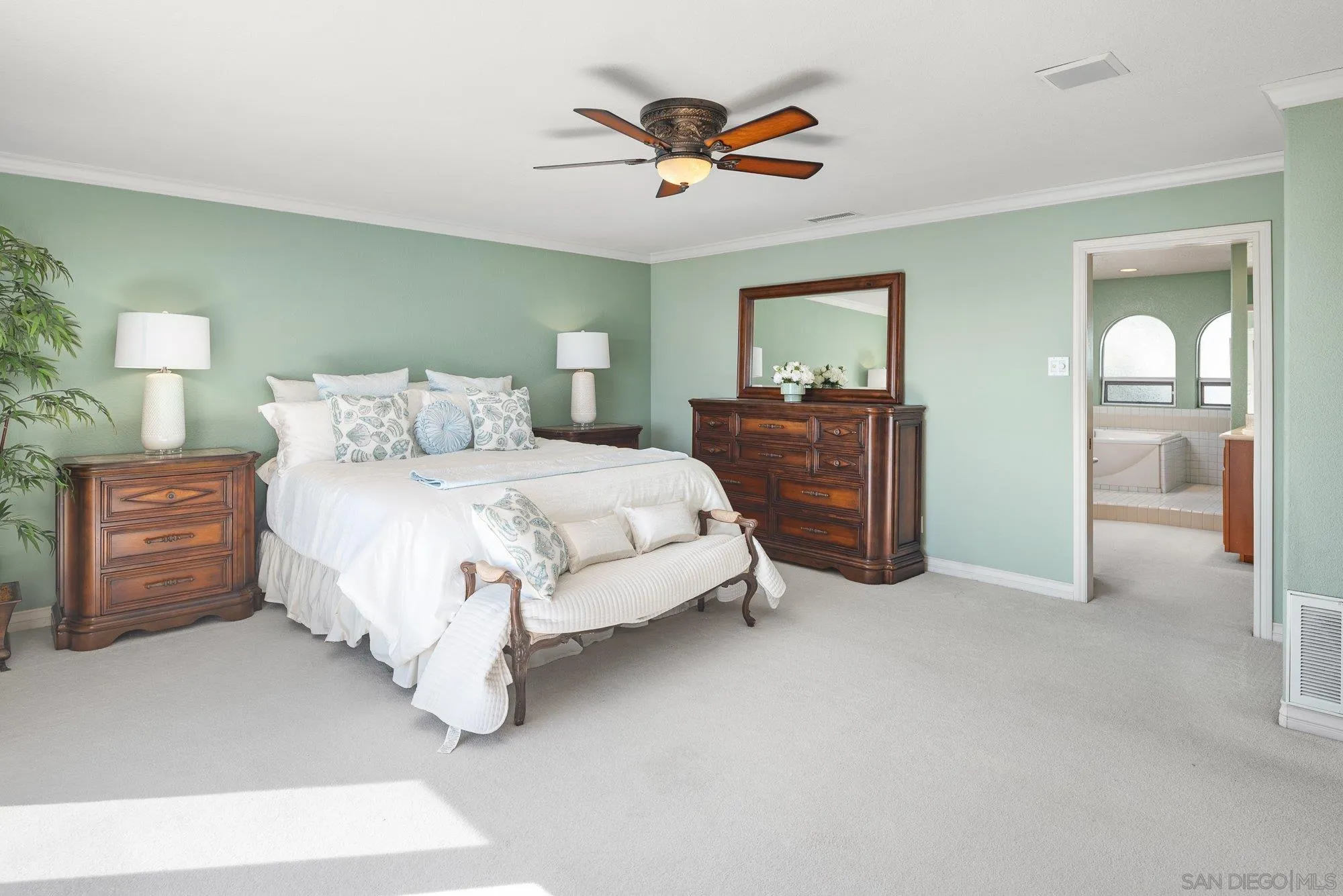 2 The Point Coronado, CA 92118 - Photo 31 of 54 a bedroom with a bed and a chandelier