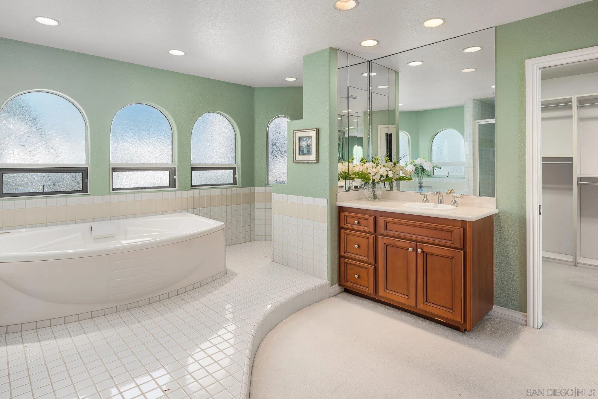 2 The Point Coronado, CA 92118 - Photo 34 of 54 a spacious bathroom with a double vanity sink a mirror and a bathtub