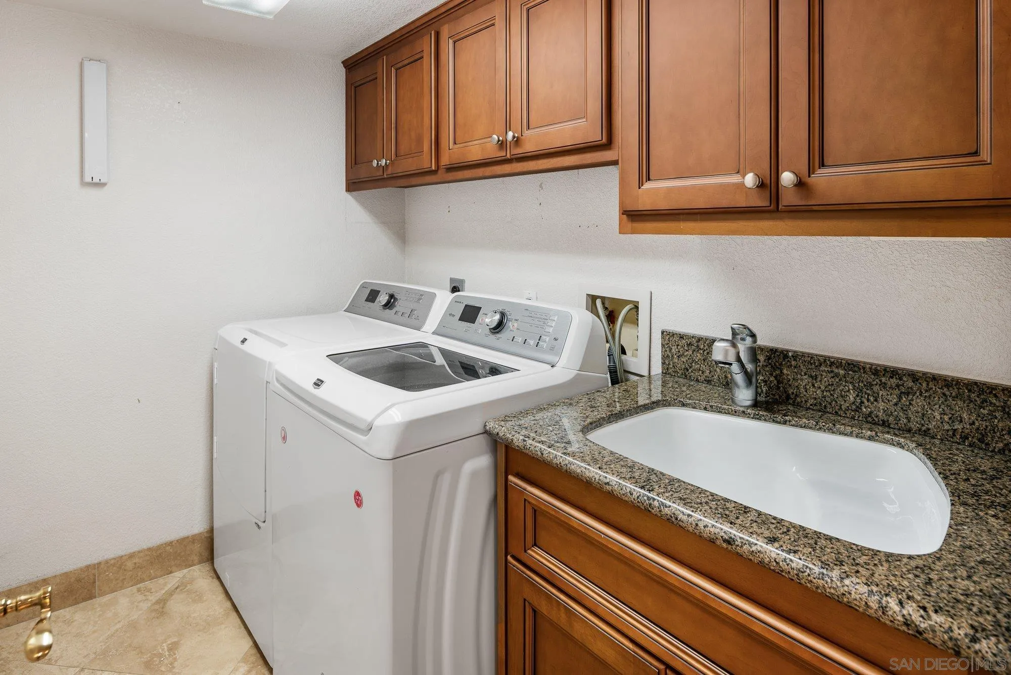 2 The Point Coronado, CA 92118 - Photo 46 of 54 a bathroom with a sink and cabinets