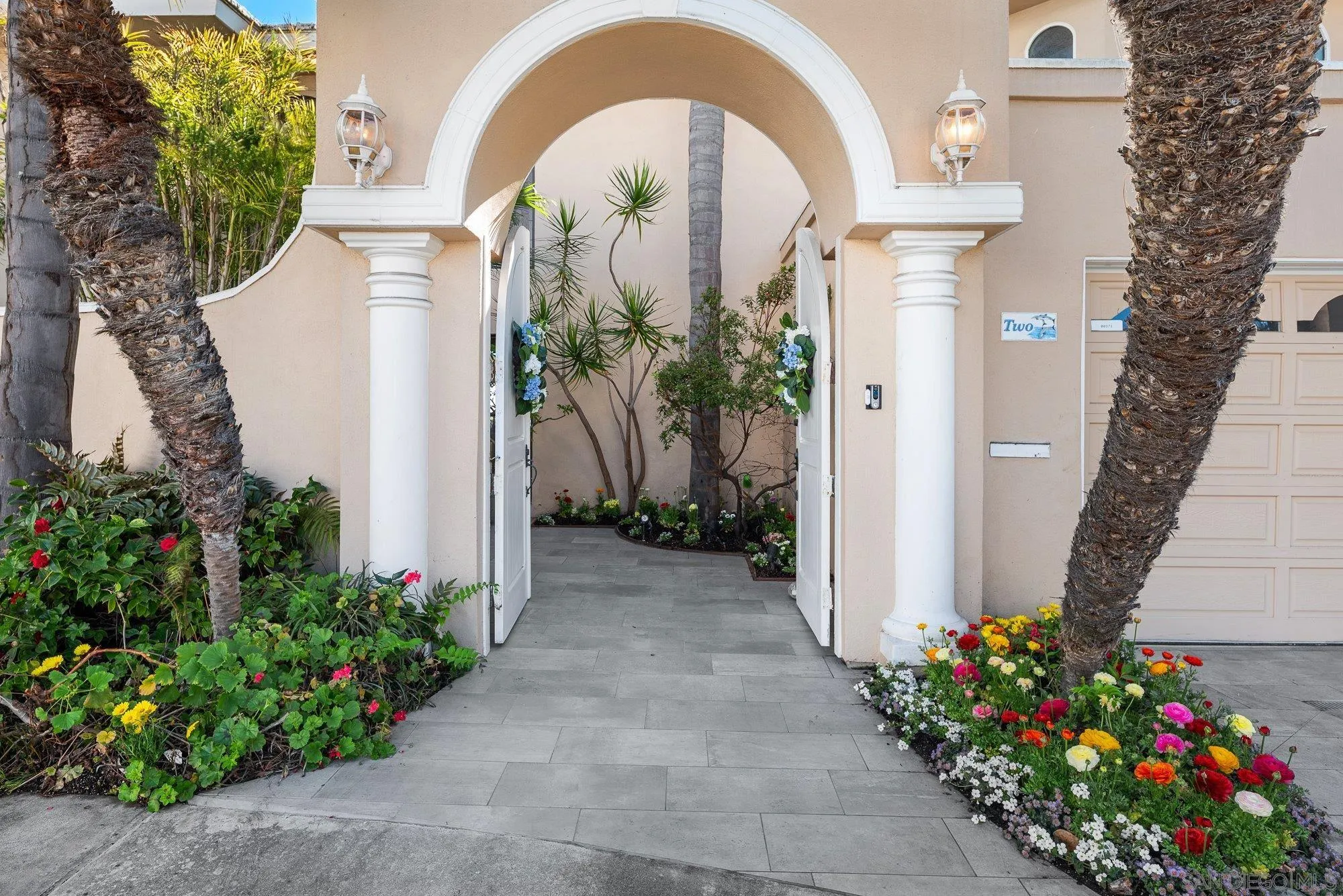 2 The Point Coronado, CA 92118 - Photo 7 of 54 a front view of a house with plants