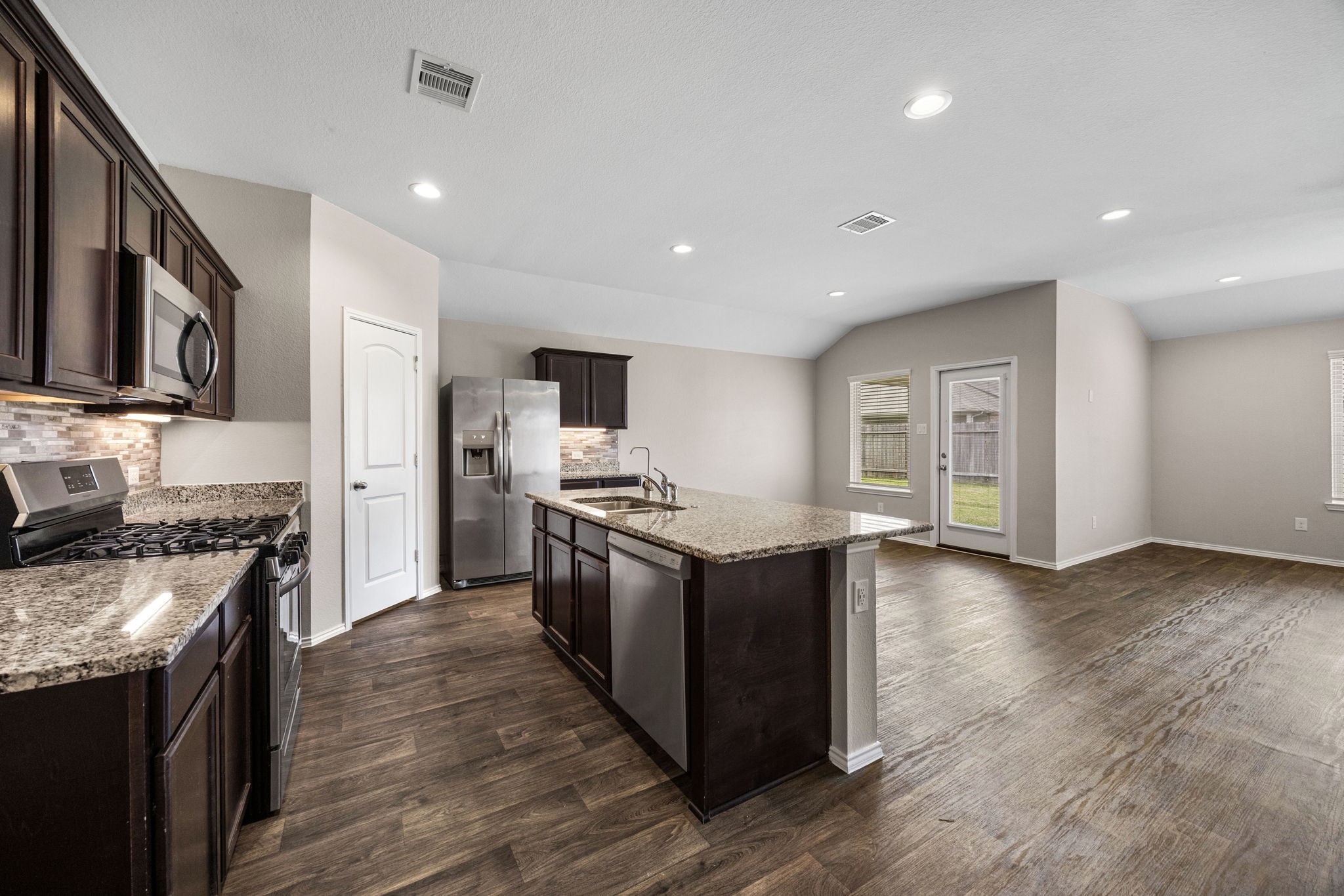 2403 Sutton Hollow Court Spring, TX 77373 - Photo 4 of 24 Open concept kitchen and living room