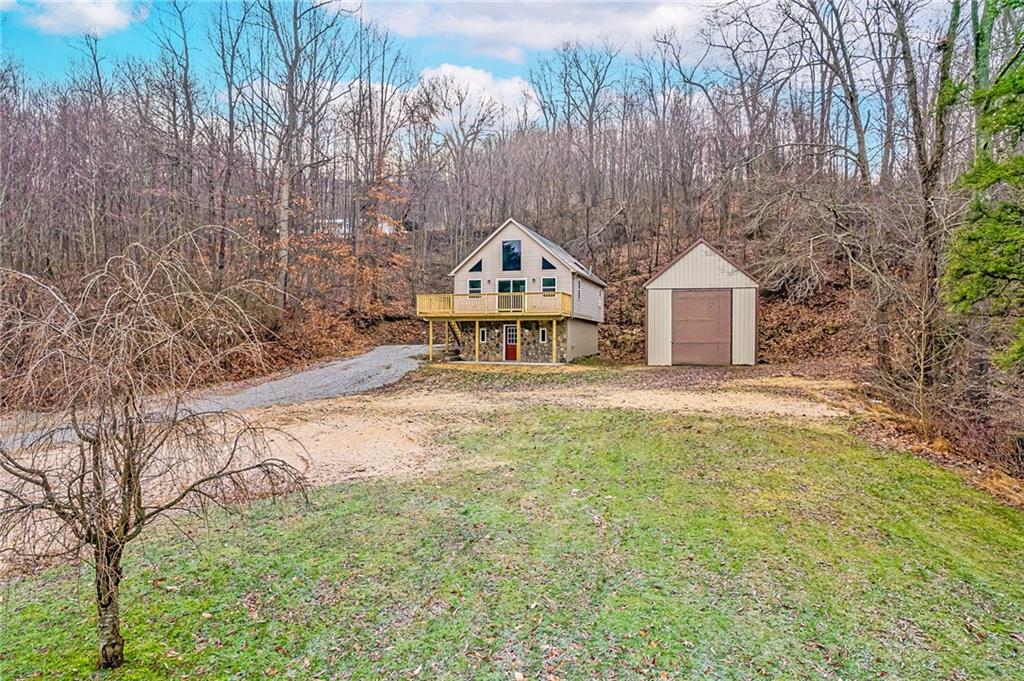 814 Breakneck Road Connellsville, PA 15425 - Photo 1 of 25 a front view of a house with a yard