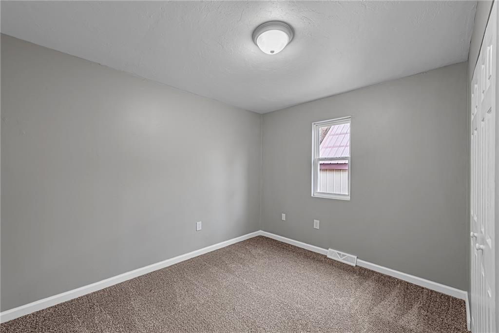 814 Breakneck Road Connellsville, PA 15425 - Photo 13 of 25 an empty room with a window