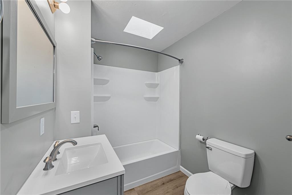 814 Breakneck Road Connellsville, PA 15425 - Photo 15 of 25 a white toilet sitting next to a bath tub