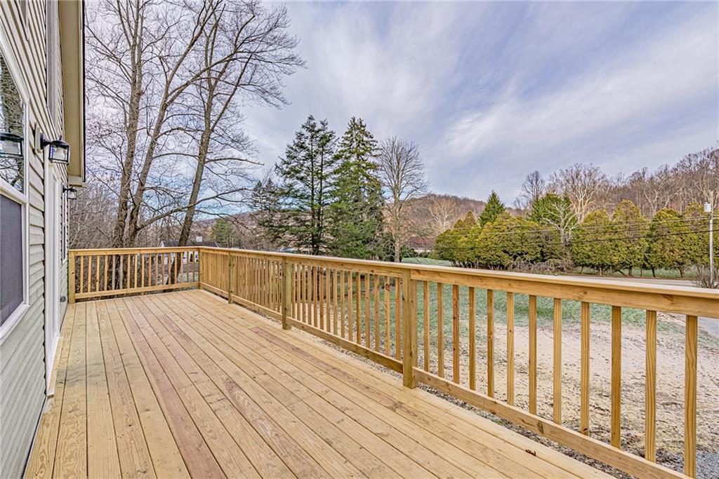 814 Breakneck Road Connellsville, PA 15425 - Photo 4 of 25 a view of balcony with wooden floor and fence