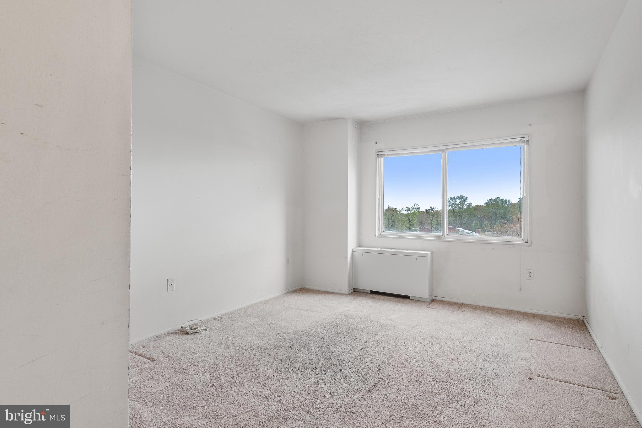 1111 University Boulevard West, Unit 805A Silver Spring, MD 20902 - Photo 11 of 33 a view of an empty room with a window