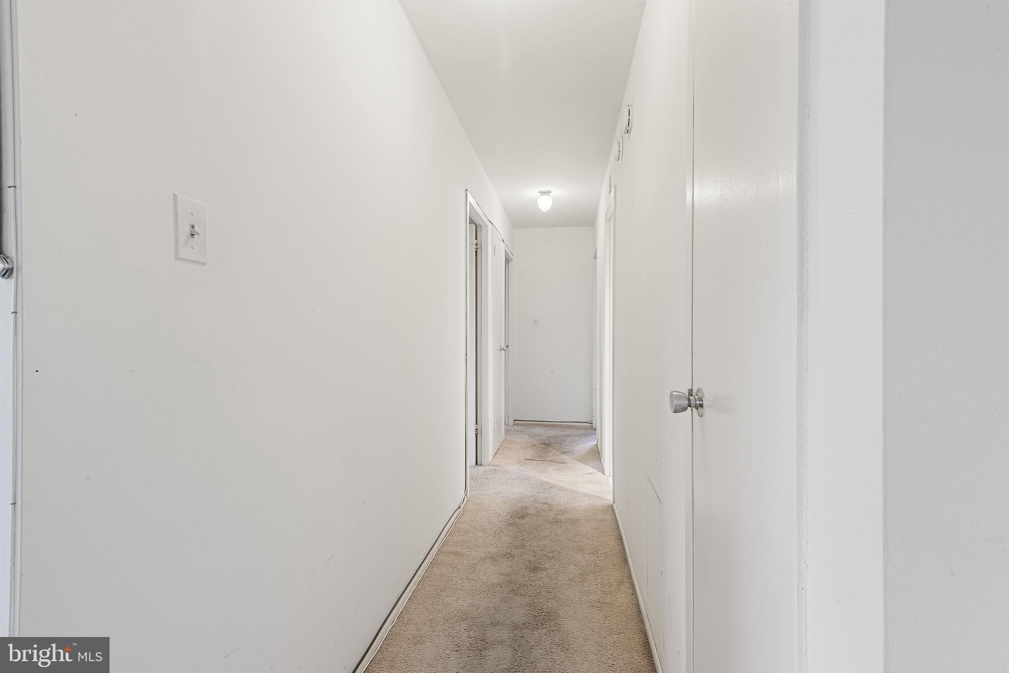 1111 University Boulevard West, Unit 805A Silver Spring, MD 20902 - Photo 12 of 33 a view of a hallway with wooden floor