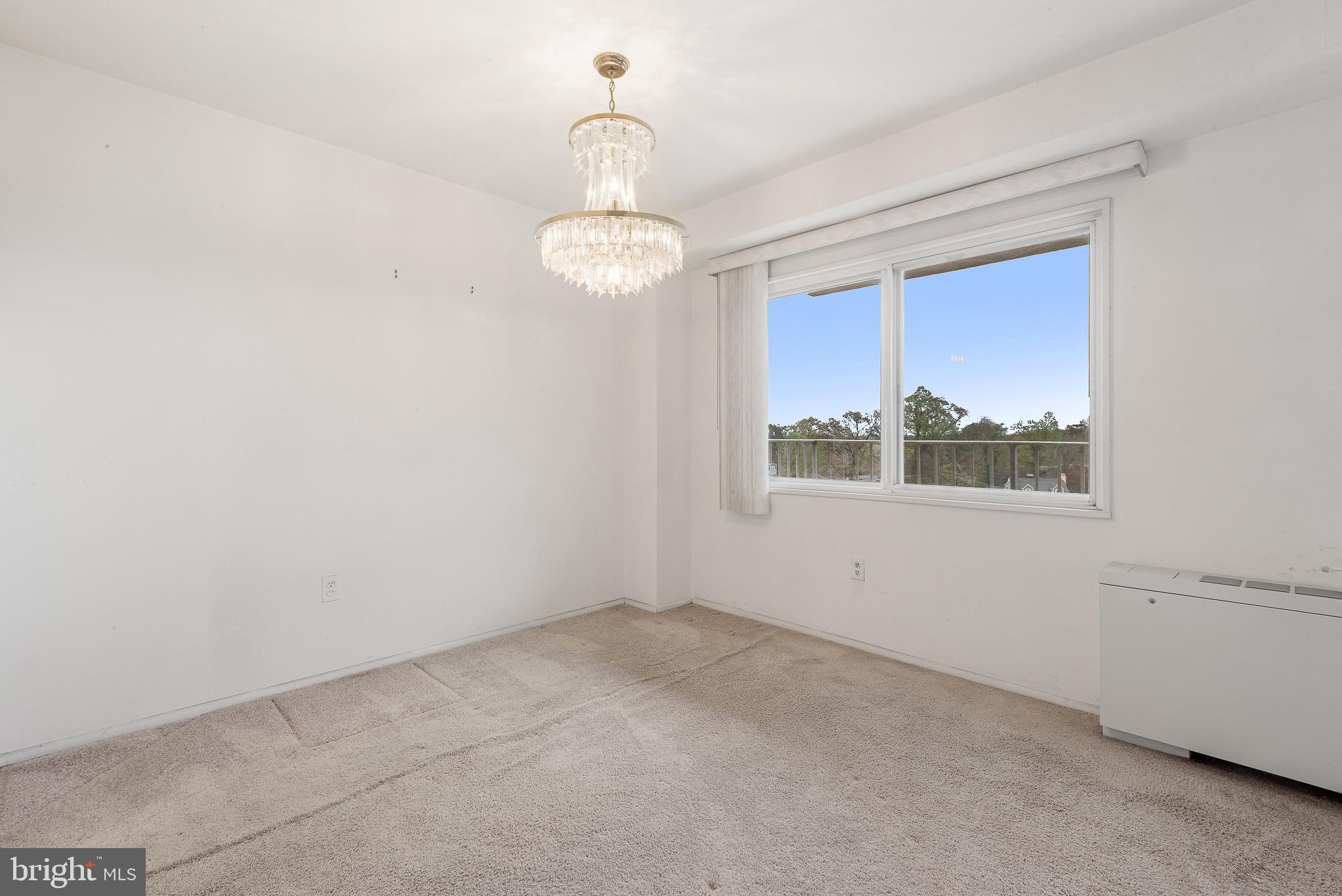1111 University Boulevard West, Unit 805A Silver Spring, MD 20902 - Photo 18 of 33 en empty room with windows