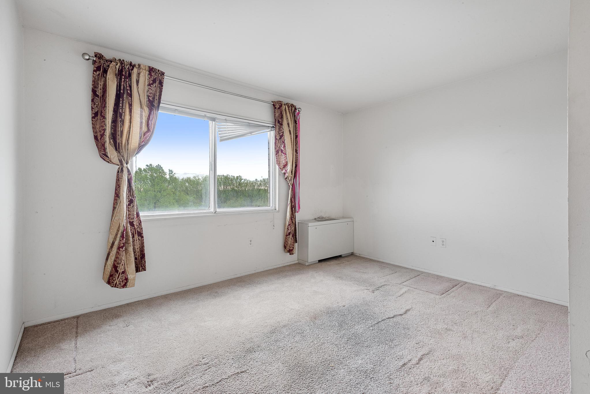 1111 University Boulevard West, Unit 805A Silver Spring, MD 20902 - Photo 23 of 33 an empty room with windows