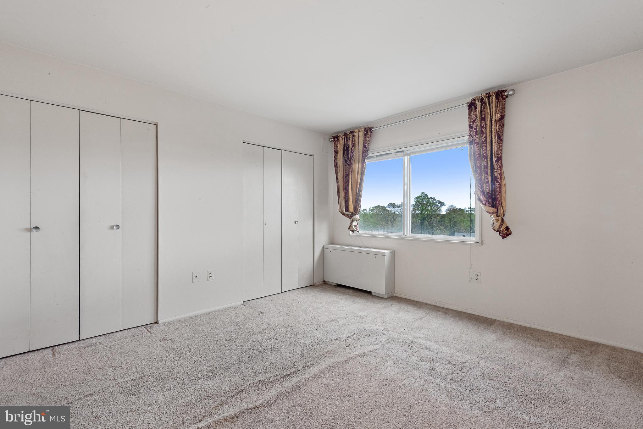 1111 University Boulevard West, Unit 805A Silver Spring, MD 20902 - Photo 26 of 33 a view of an empty room with a window