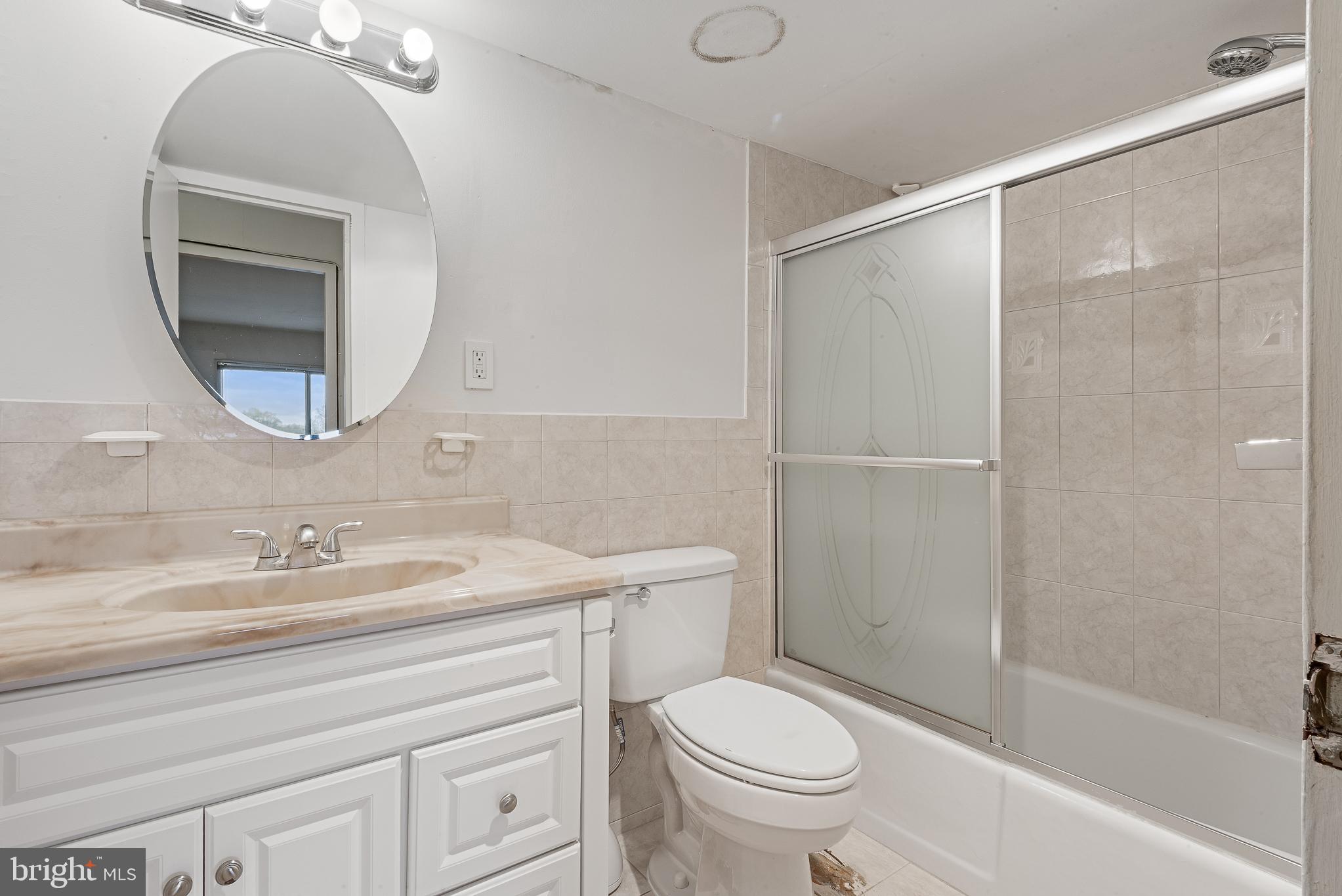 1111 University Boulevard West, Unit 805A Silver Spring, MD 20902 - Photo 29 of 33 a bathroom with a sink toilet and shower