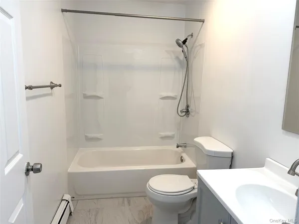 a bathroom with a sink a toilet and a bathtub
