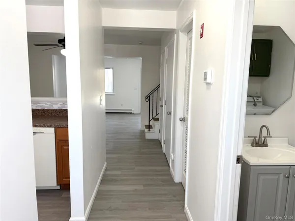 a view of a bathroom from a hallway