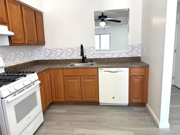 a kitchen with a stove and cabinets