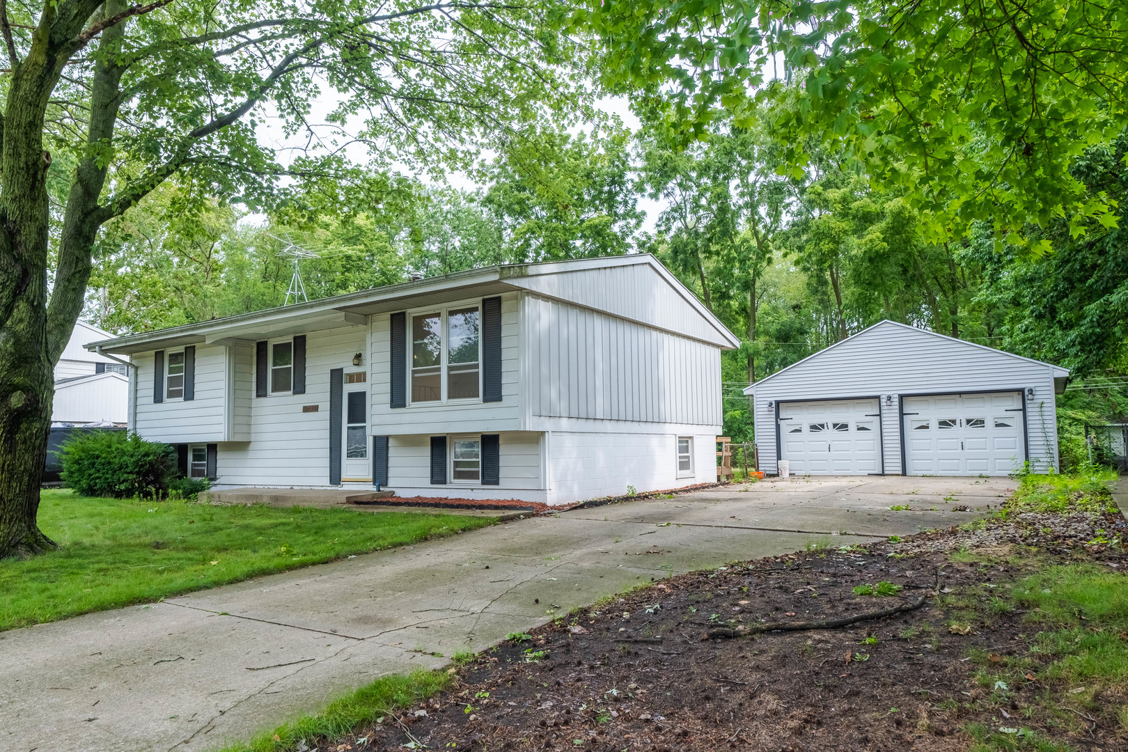2410 West William Street Champaign, IL 61821 - Photo 1 of 1 a front view of a house with a yard and garage