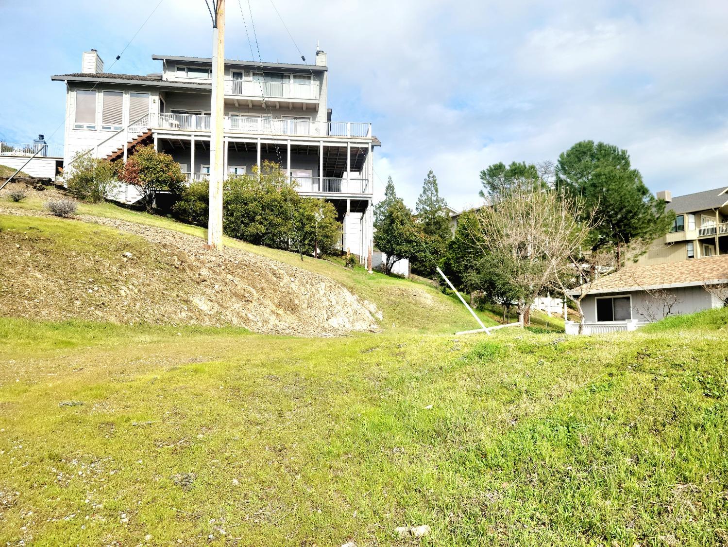 835 Foothill Road Copperopolis, CA 95228 - Photo 2 of 20 a front view of a house with a yard