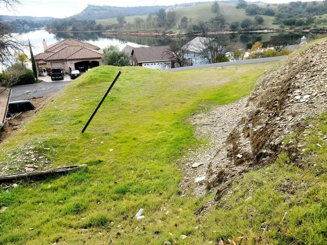 a view of a lake with a yard