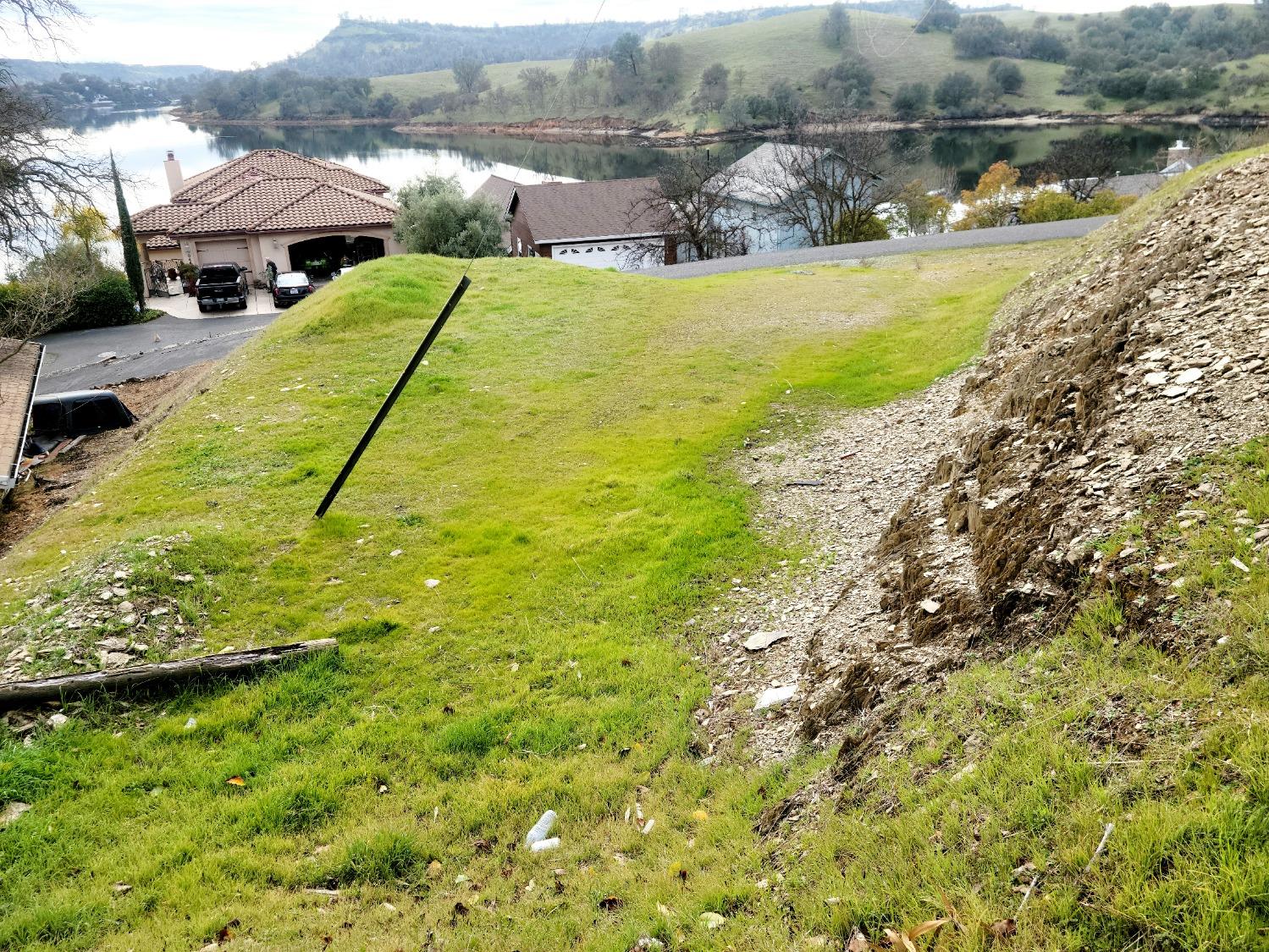 835 Foothill Road Copperopolis, CA 95228 - Photo 3 of 20 a view of a lake with a yard