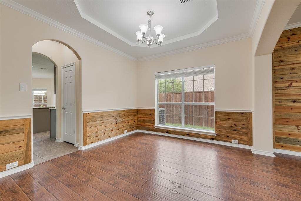 623 Lone Ridge Way Murphy, TX 75094 - Photo 11 of 40 wooden floor in an empty room with a window