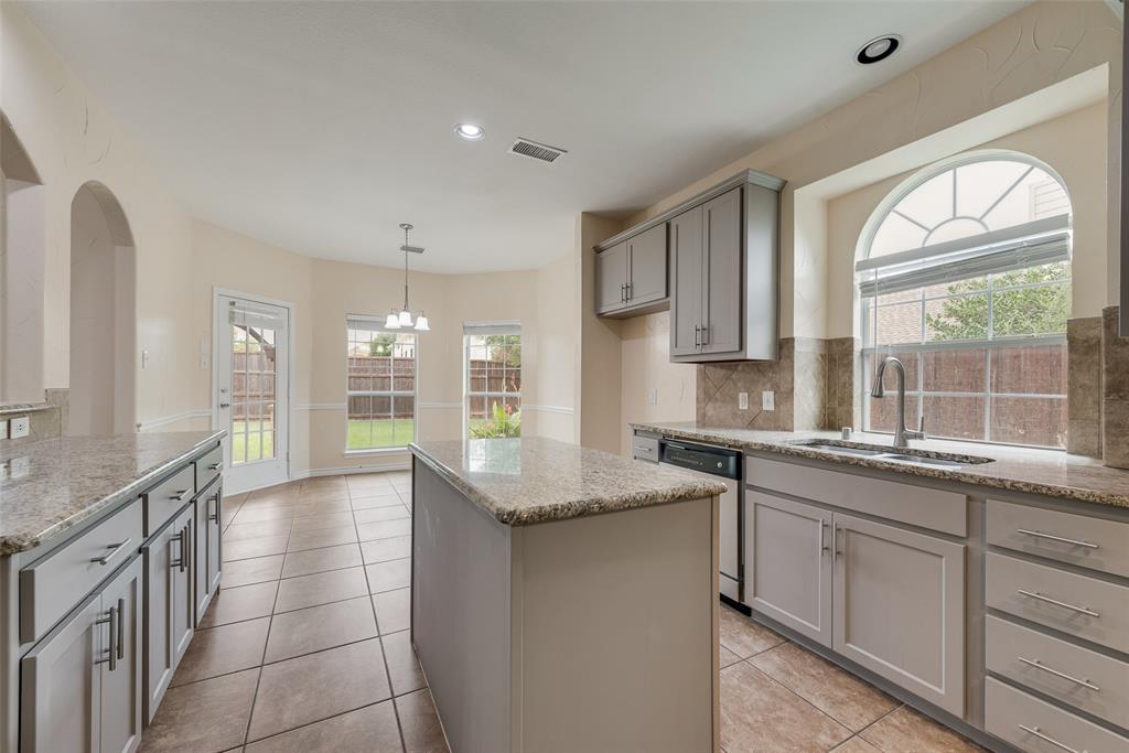 623 Lone Ridge Way Murphy, TX 75094 - Photo 15 of 40 a kitchen with a sink and large window