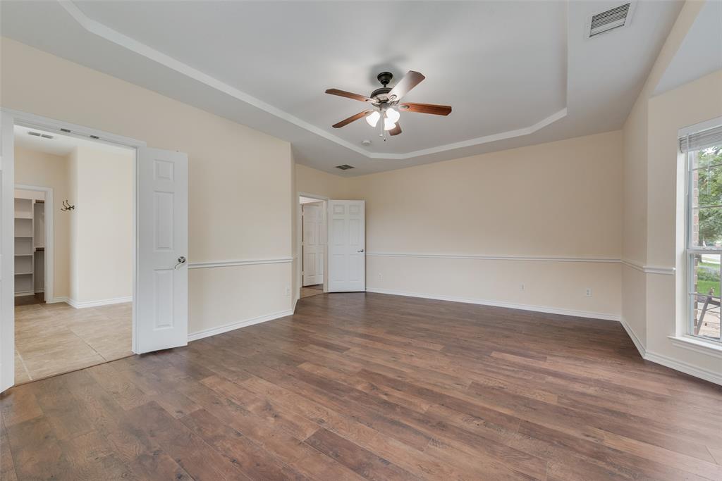 623 Lone Ridge Way Murphy, TX 75094 - Photo 22 of 40 a view of an empty room with wooden floor and a window