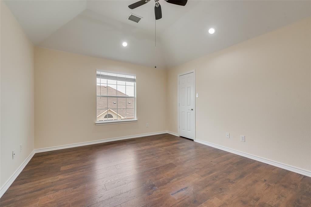 623 Lone Ridge Way Murphy, TX 75094 - Photo 32 of 40 wooden floor in an empty room with a window