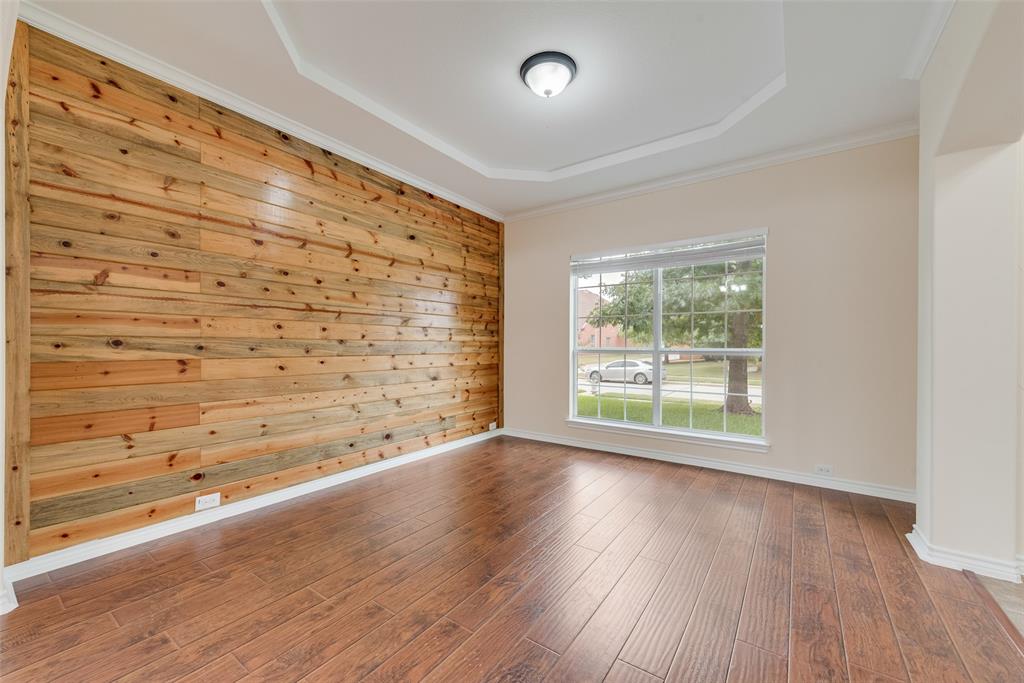 623 Lone Ridge Way Murphy, TX 75094 - Photo 7 of 40 wooden floor in an empty room with a window