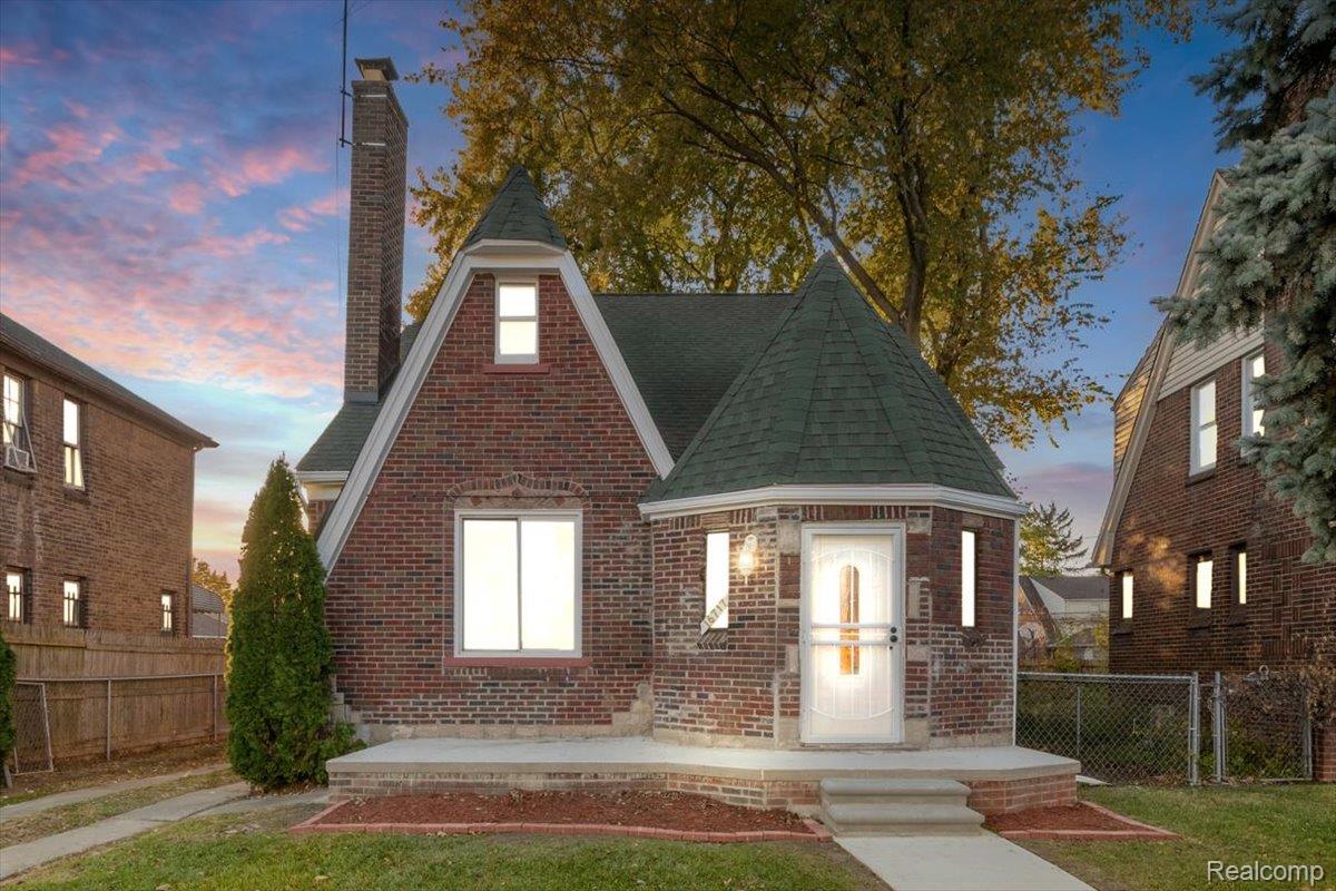 16717 Fielding Street Detroit, MI 48219 - Photo 2 of 46 View of front facade featuring a chimney, a shingled roof, and brick siding