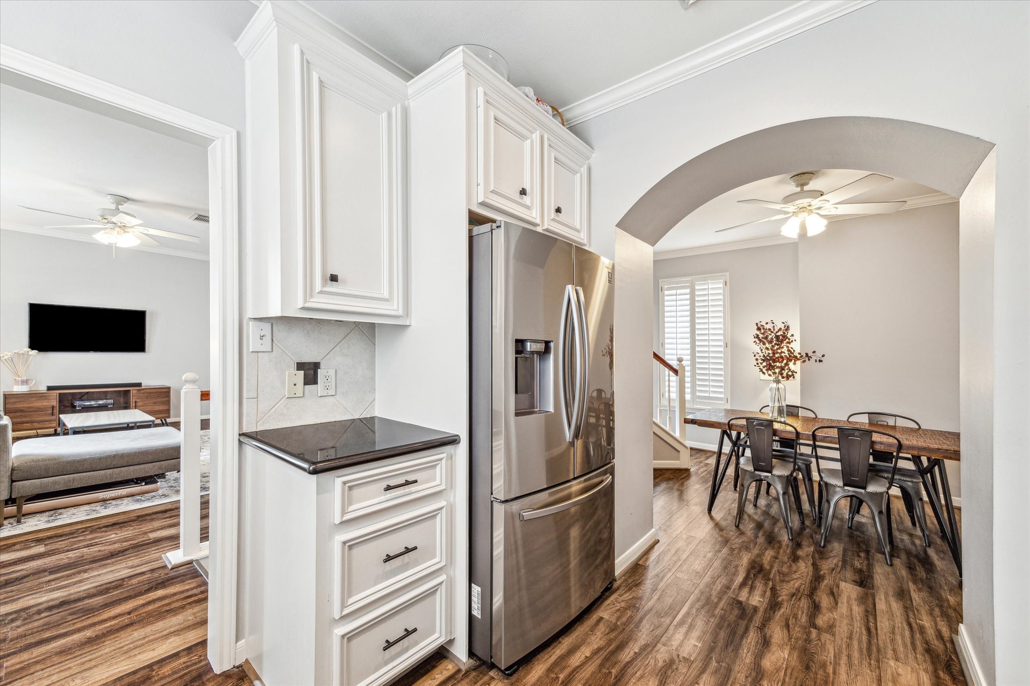 1213 Oneil Street, Unit B Houston, TX 77019 - Photo 8 of 20 a kitchen with white cabinets and stainless steel appliances