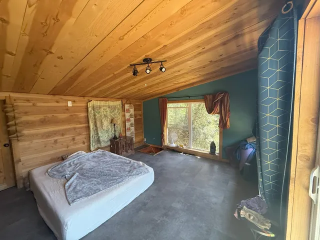 a living room with couch next to a window