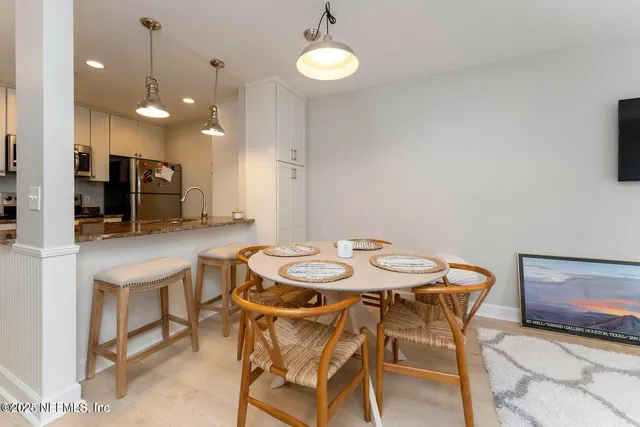 a view of a dining room with furniture