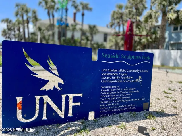 a view of swimming pool with a backyard and chairs