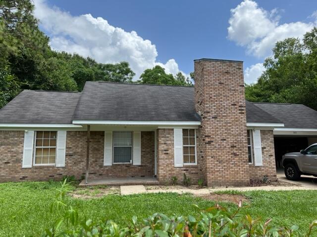 front view of a house with a yard