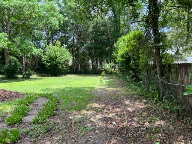 305 Hudson Drive Crestview, FL 32539 - Photo 13 of 16 a view of a green field with trees