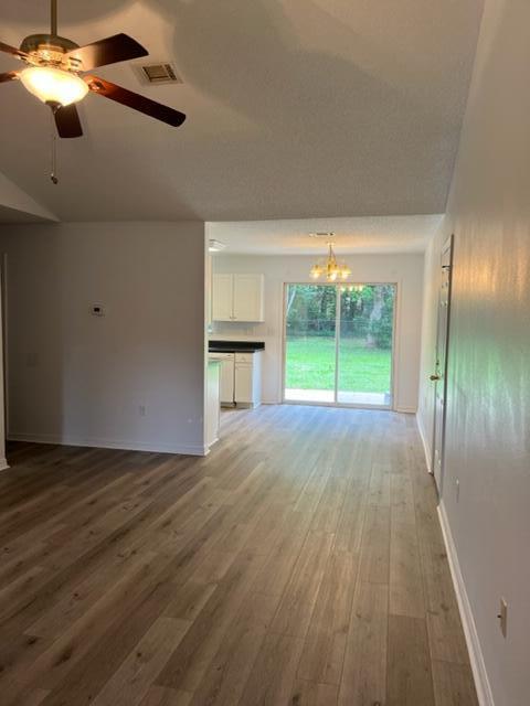 305 Hudson Drive Crestview, FL 32539 - Photo 3 of 16 a view of empty room with wooden floor and fan