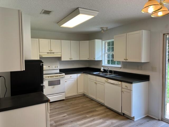 305 Hudson Drive Crestview, FL 32539 - Photo 4 of 16 a kitchen with granite countertop a sink cabinets and stainless steel appliances