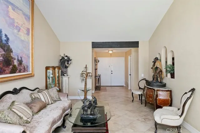 a living room with furniture fireplace and a fireplace