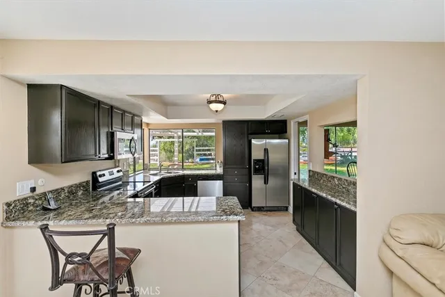 a room with furniture a rug and a window