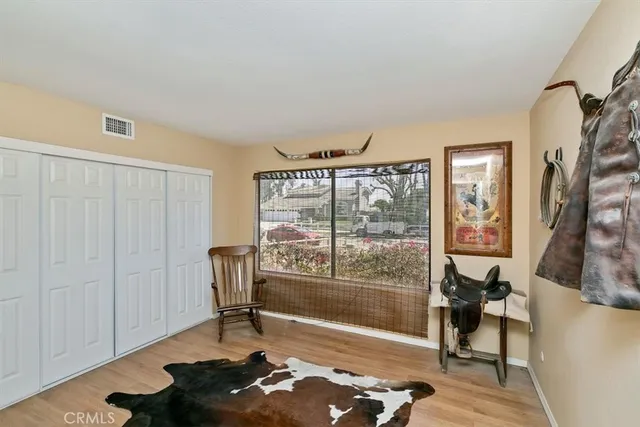 a bathroom with a granite countertop sink toilet and mirror