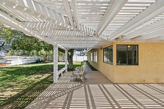 a view of a swimming pool with a yard