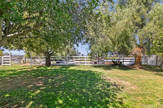 a view of a swimming pool with an outdoor space and seating area