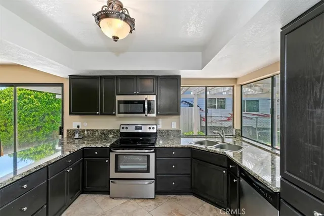 a view of a chairs and table in the patio