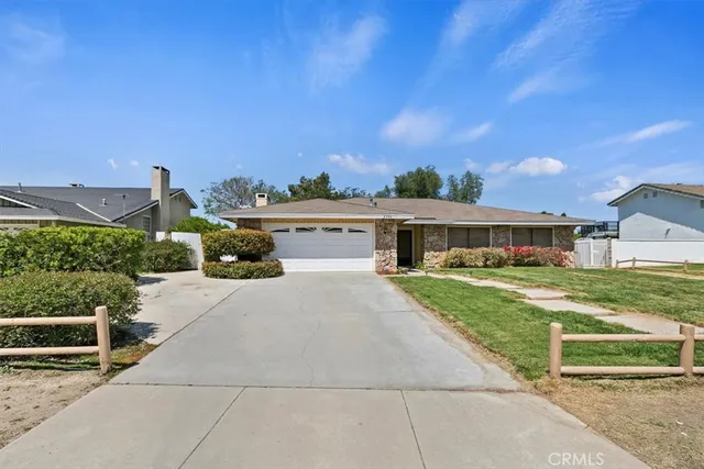 an aerial view of a house with a garden