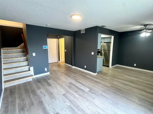 a view of a livingroom with wooden floor