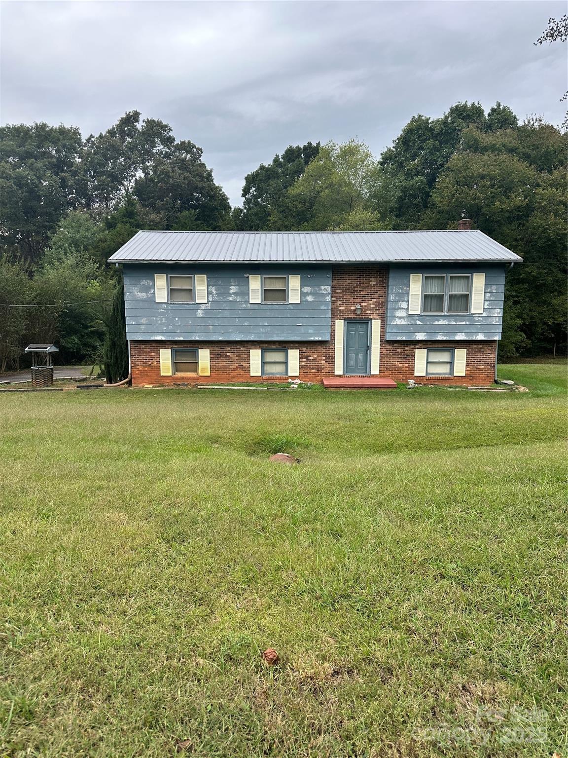 front view of a house with a big yard