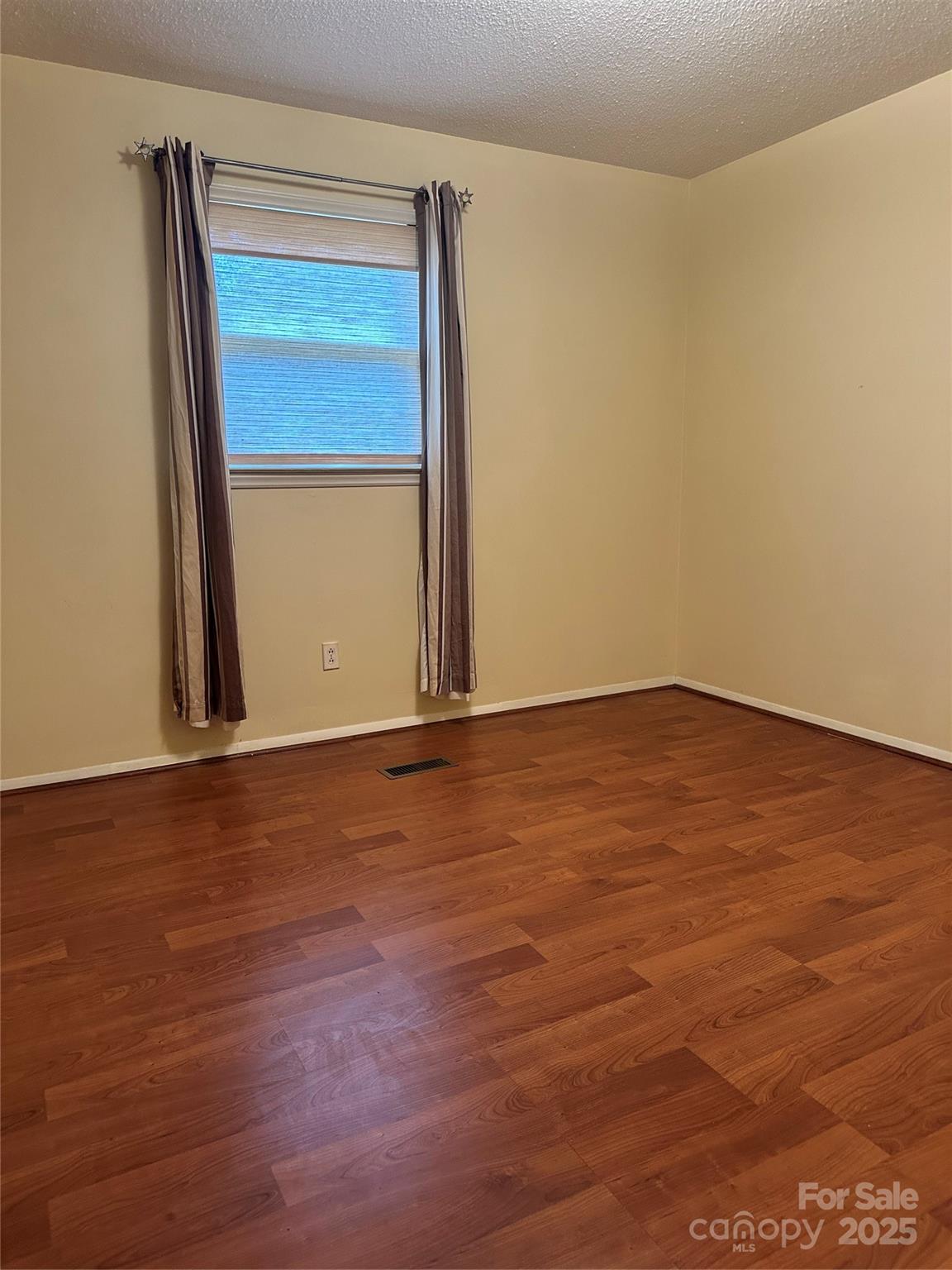 5079 Archdale Drive Conover, NC 28613 - Photo 14 of 30 an empty room with wooden floor and closet