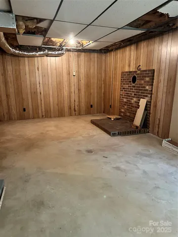 a view of a room with stairs and a wooden chair
