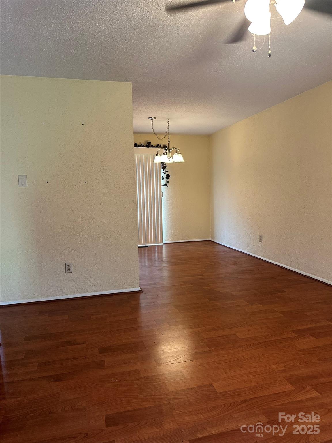 5079 Archdale Drive Conover, NC 28613 - Photo 7 of 30 an empty room with wooden floor table and chairs